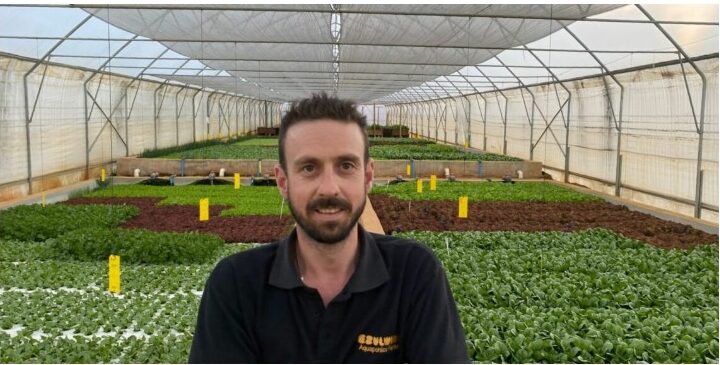 Lliam Roach of Ezulwini Africa standing in the aquaponic growing tunnel in Dullstroom, as featured in the Food For Mzansi article
